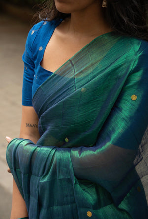 Peacock tissue silk saree pleats and tassel detail
