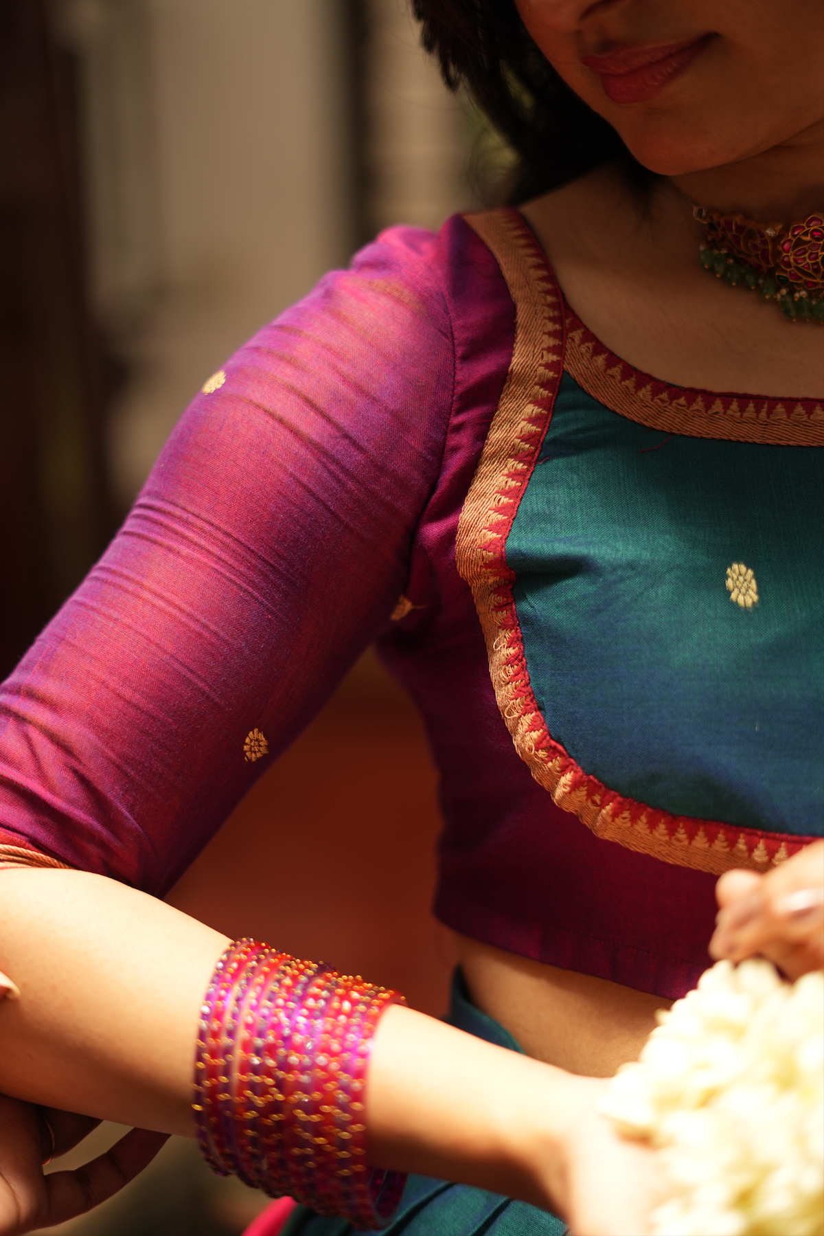 Detailed view of the Narayanpet half saree blouse sleeve featuring handloom weaving, traditional borders, and artisanal craftsmanship.