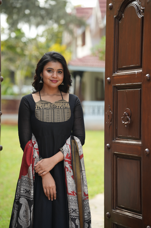 Black Kalamkari Fusion Anarkali suit for women featuring a temple border yoke and handcrafted Kalamkari dupatta.