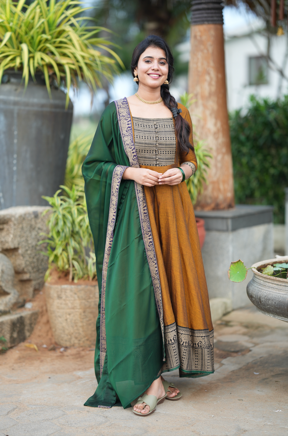 Thenmozhi mustard Kalamkari fusion Anarkali suit with green dupatta and traditional Narayanpet-inspired handloom detailing