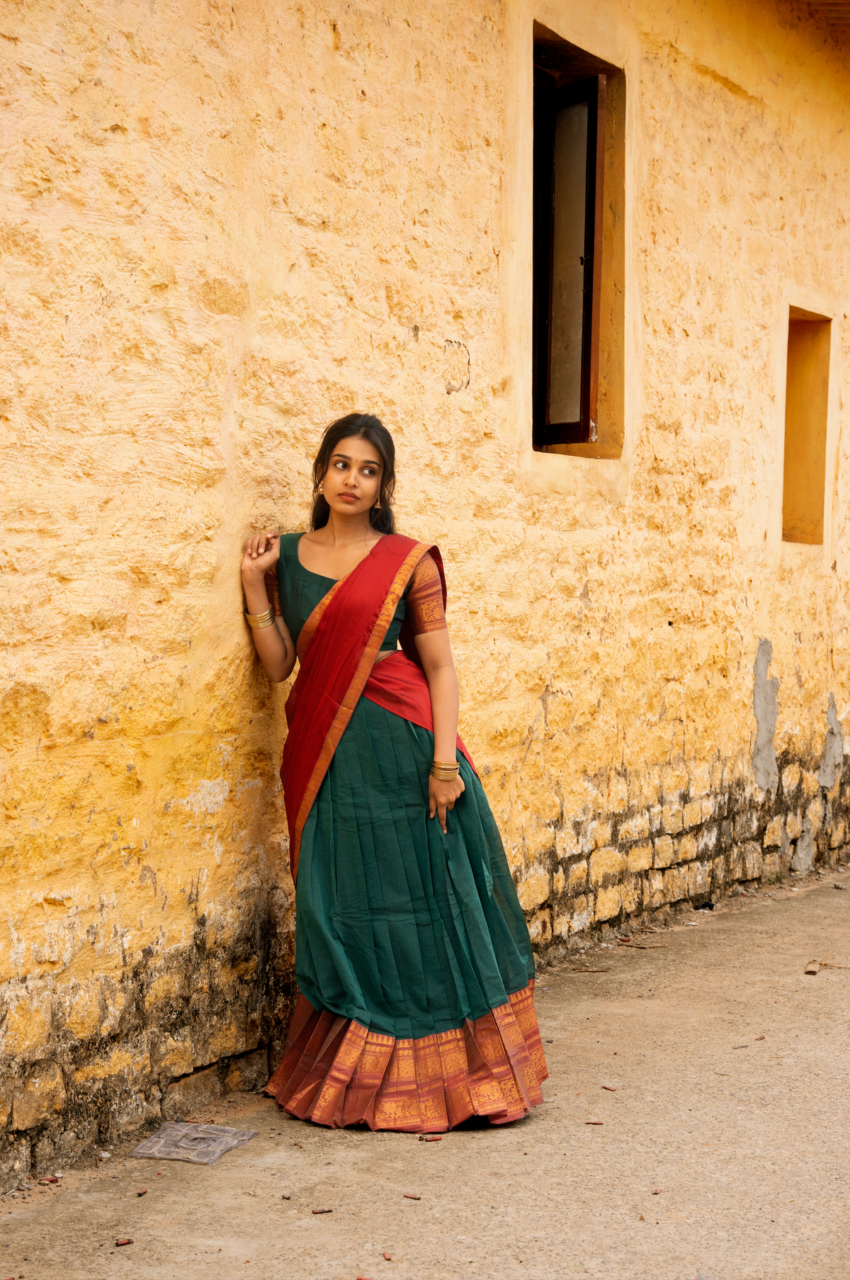 Rainbow dreams-Iconic red with green paavadai dhaavani set
