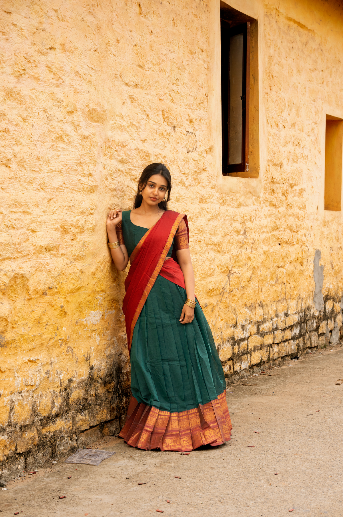 Rainbow dreams-Iconic red with green paavadai dhaavani set