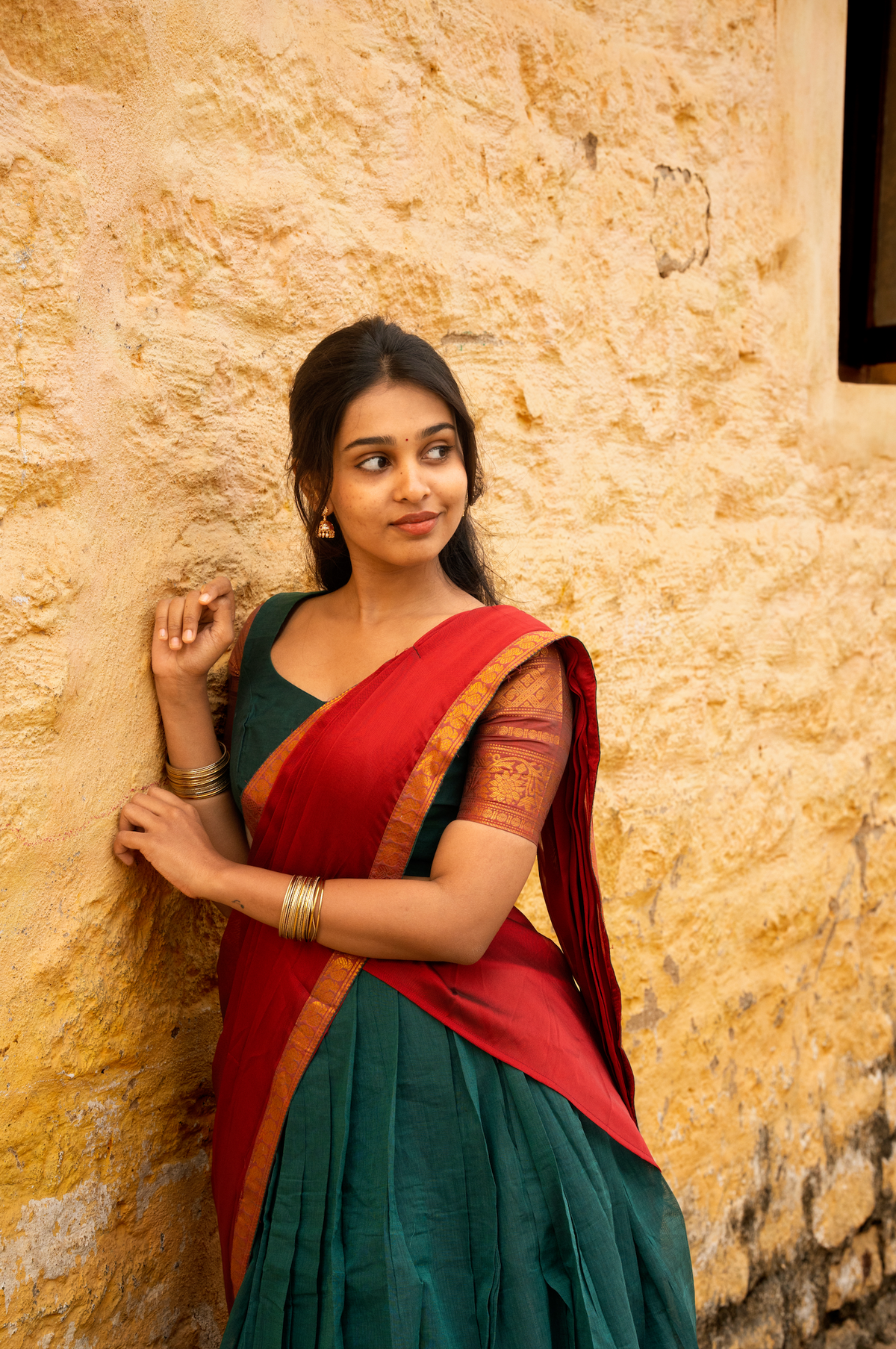 Rainbow dreams-Iconic red with green paavadai dhaavani set