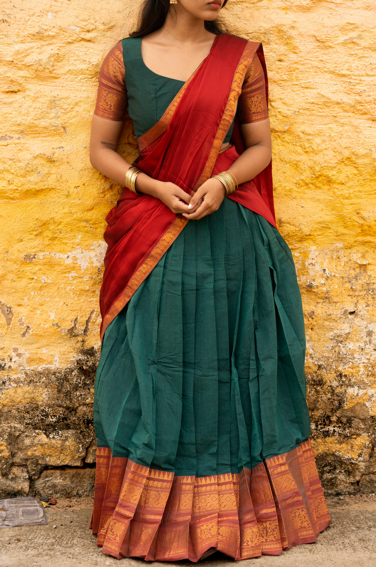 Rainbow dreams-Iconic red with green paavadai dhaavani set