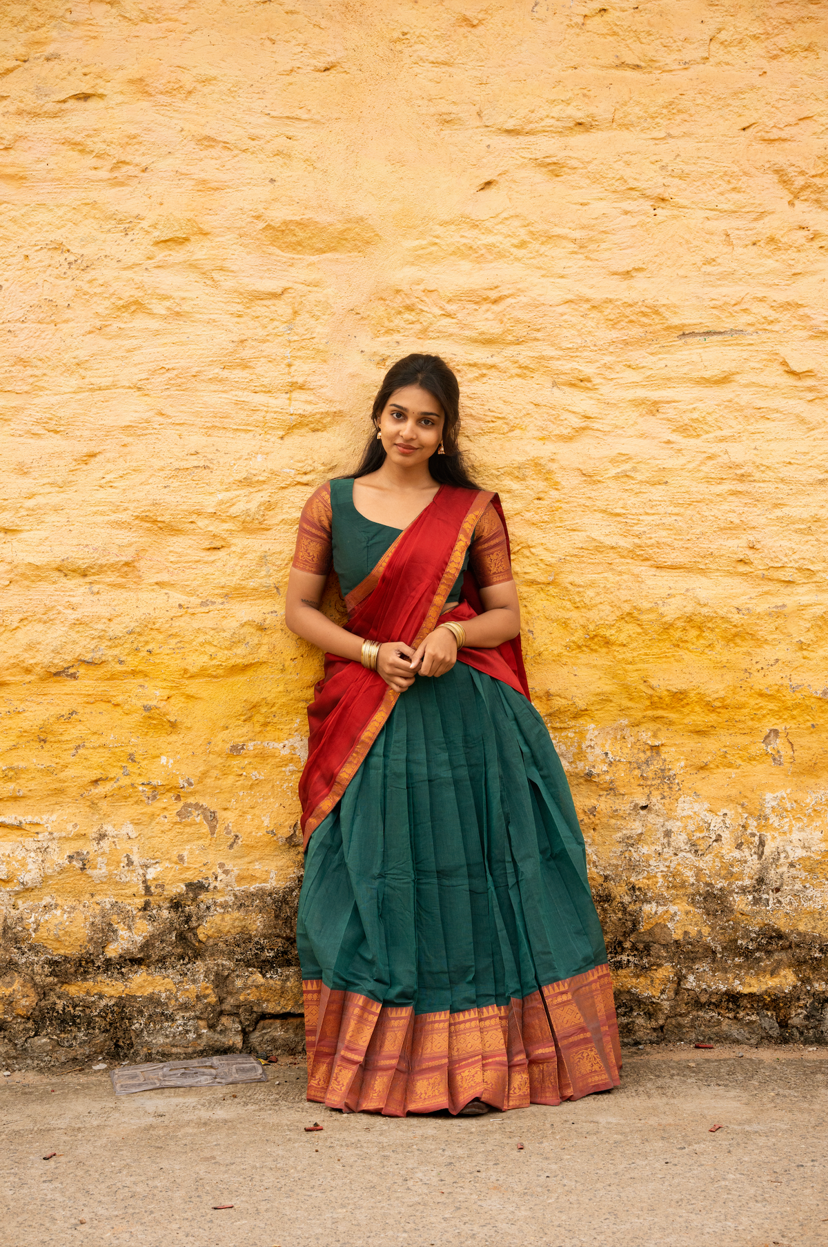 Rainbow dreams-Iconic red with green paavadai dhaavani set