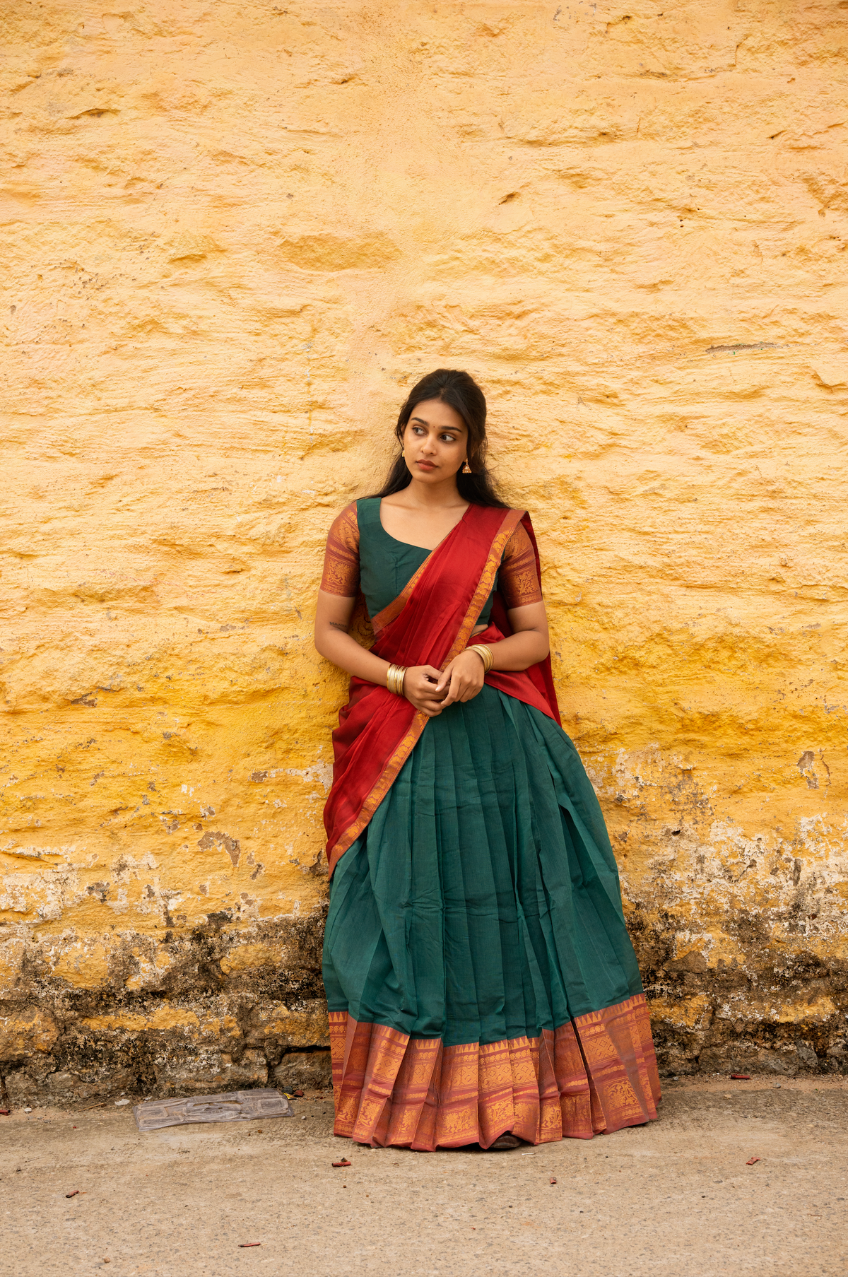Rainbow dreams-Iconic red with green paavadai dhaavani set