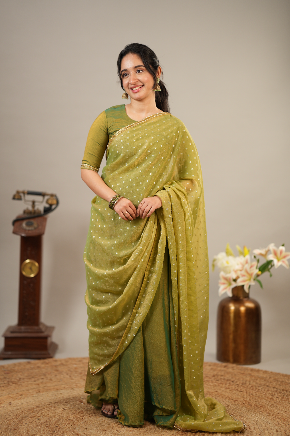 Designer tissue silk ethnic outfit in mehendi green with flared festive silhouette and embroidered detailing
Filename: