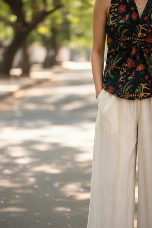 Detailed view of the floral cotton crop top highlighting the front twist design, floral motifs, and tailored silhouette.
