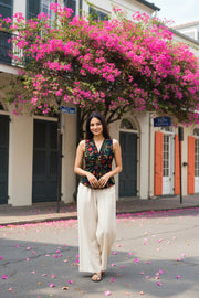Twilight floral print crop top for women featuring a sleeveless V-neck design, paired with wide-leg trousers and styled for casual elegance.