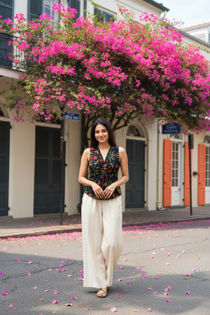 Twilight floral print crop top for women featuring a sleeveless V-neck design, paired with wide-leg trousers and styled for casual elegance.