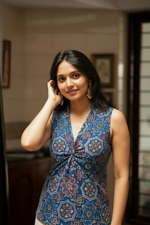 Women’s indigo blue floral print crop top with a flattering V-neckline and elegant sleeveless silhouette for casual styling.