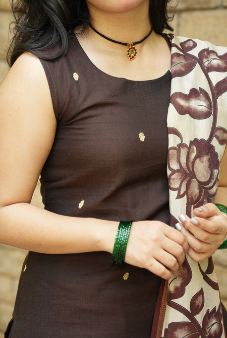 Close-up of coffee brown Narayanpet handloom kurta fabric with minimal ethnic embellishment detailing