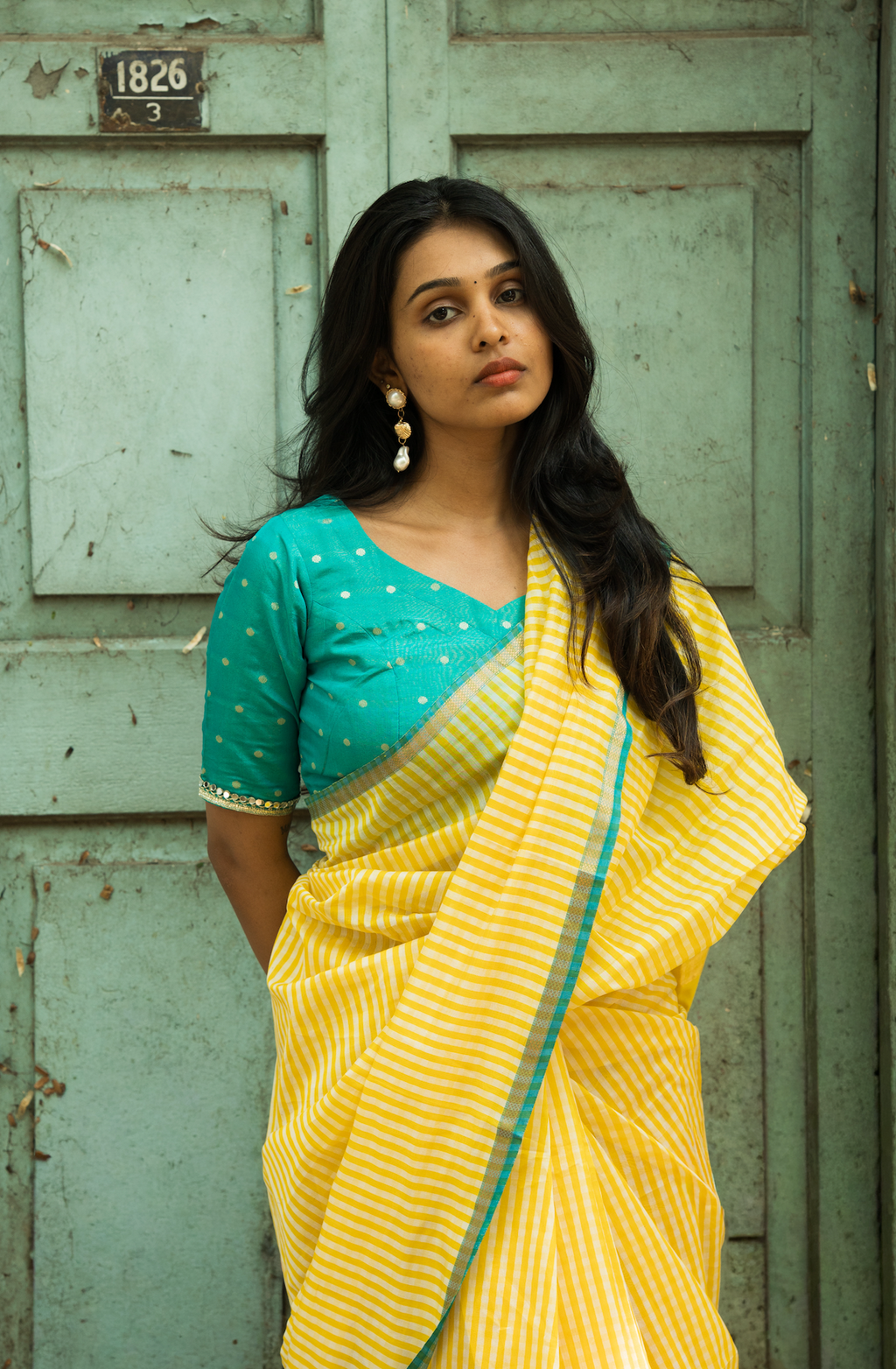 Pure handwoven Maheshwari silk saree in dual shade yellow gingham checks with broad woven border