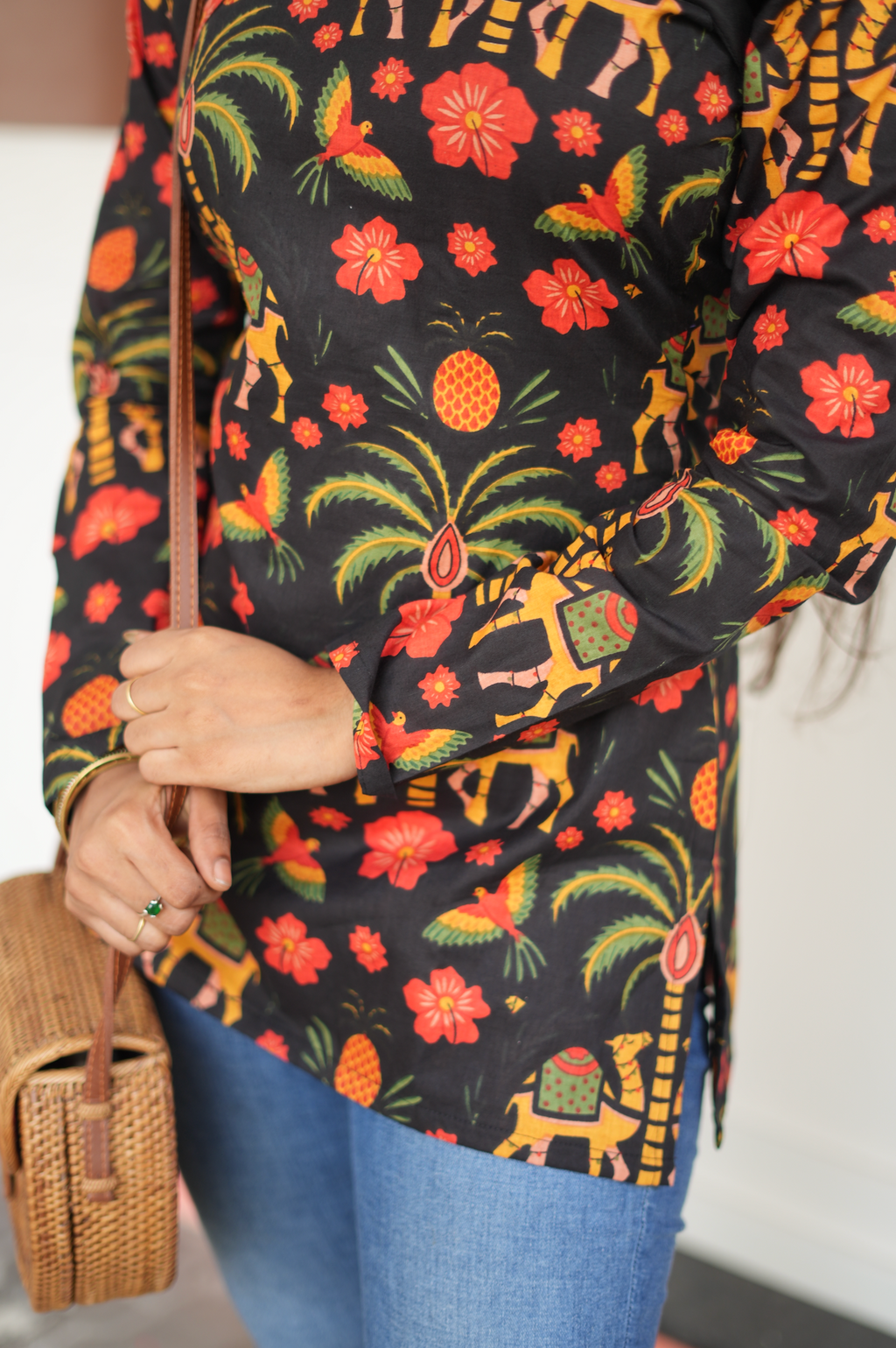 Close-up of Jaipuri block print fabric – elephant, palm tree and floral motifs on dark cotton Kurti
