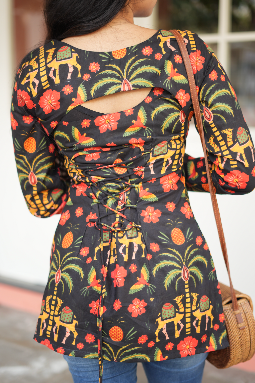 Side view of Jaipuri cotton block print Kurti highlighting asymmetric hem and zigzag side adjustment knots