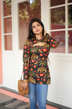 Relaxed pose in dark Jaipuri cotton Kurti with elephant folk print – short asymmetric Kurti for casual Indian wear