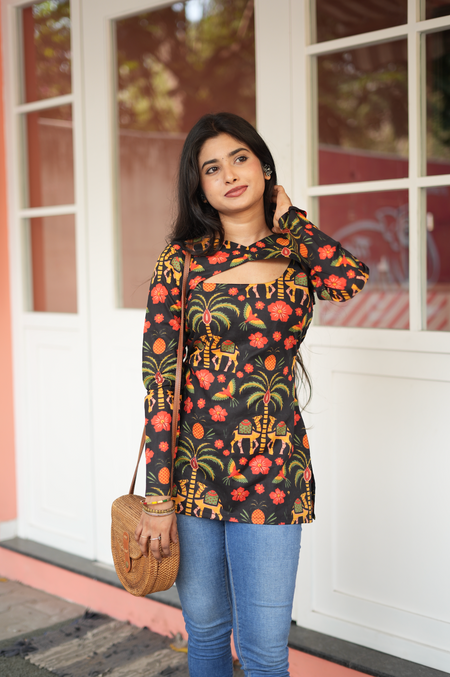 Relaxed pose in dark Jaipuri cotton Kurti with elephant folk print – short asymmetric Kurti for casual Indian wear