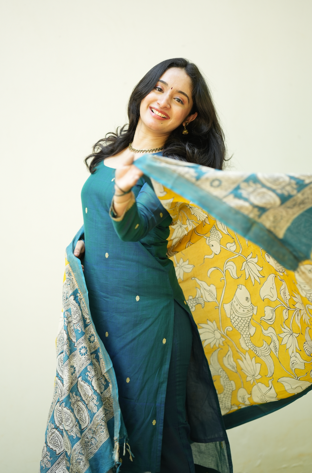 Flowy Kalamkari dupatta paired with teal blue handloom kurta set for festive and comfort occasions