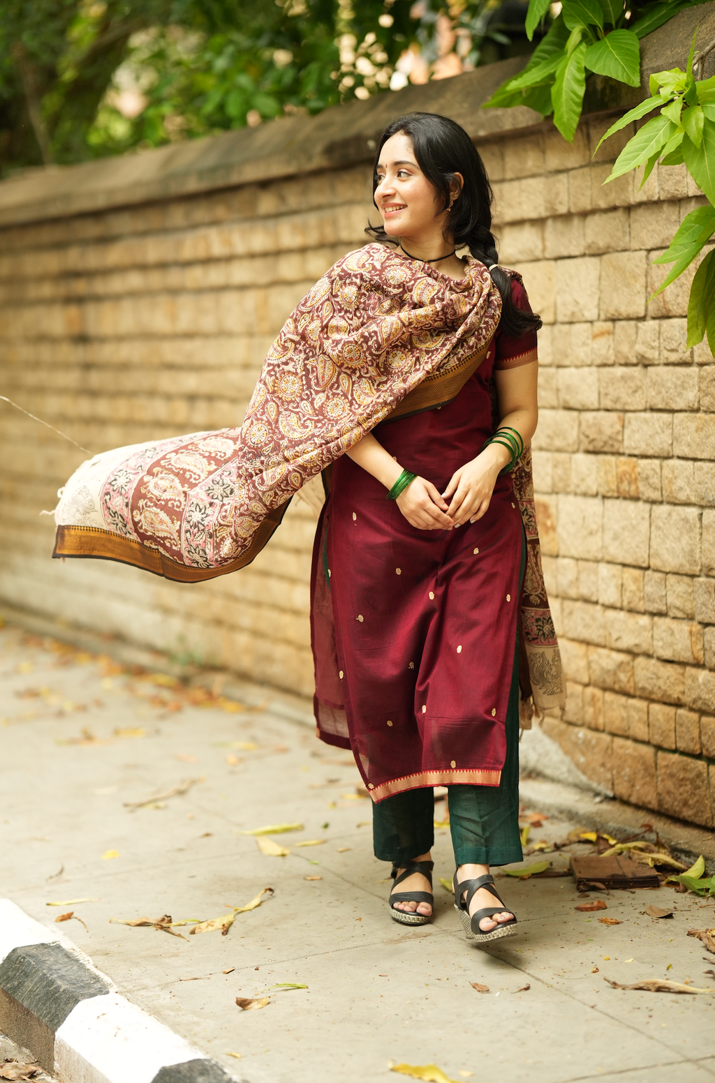 Women’s maroon ethnic handloom outfit with printed Kalamkari dupatta and festive Indian silhouette