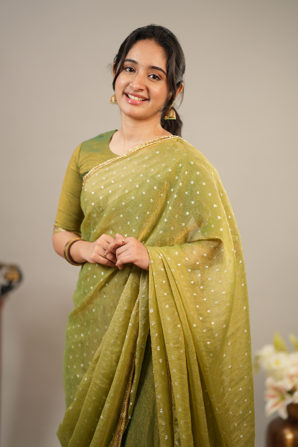 Designer mehendi green tissue silk suit set with festive Indian ethnic styling and flared silhouette