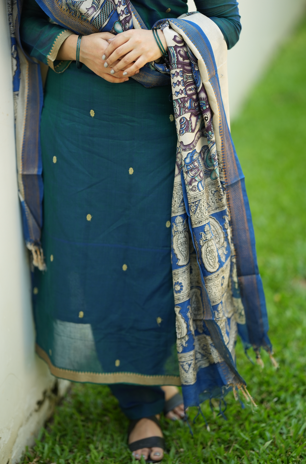 Close-up of peacock blue Narayanpet handloom fabric with elegant ethnic detailing and woven texture