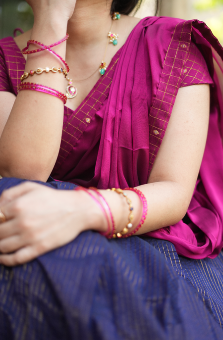 Close-up of plum raw silk blouse sleeve in Chettinad handloom dhavani set